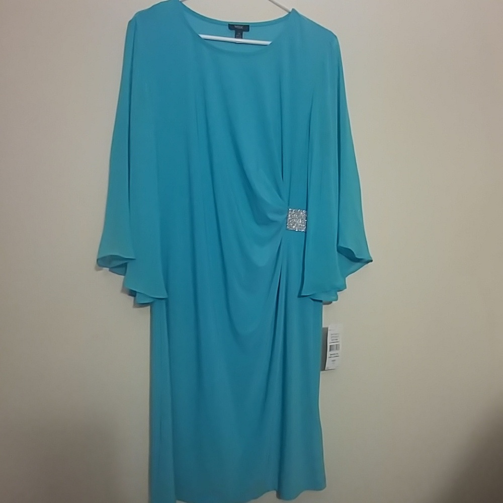 A light blue bell sleeve dress with rhinestones